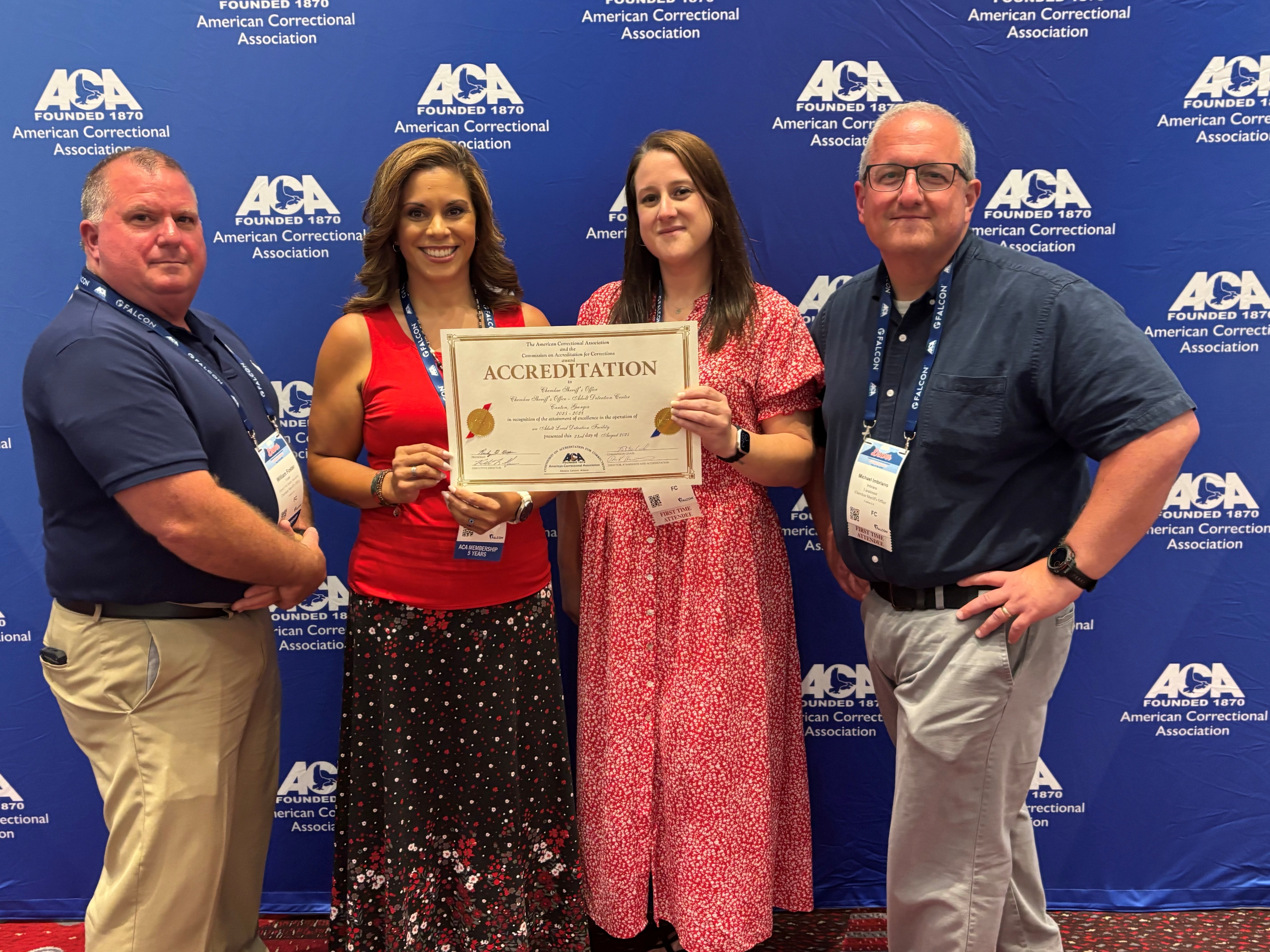 Pictured from Lef to right: Deputy Paul Foster, Captain Irene Ruiz, Ashley Ray - Jail Accreditation Manager, and Lt. Michael Imbriano. Ashley is holding out an Accreditation certificate.